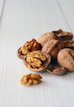 Walnuts on rustic old wooden table Stock Photos