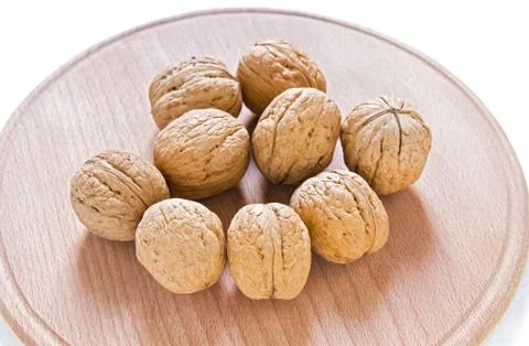 Walnuts on rustic  wooden table Stock Photos