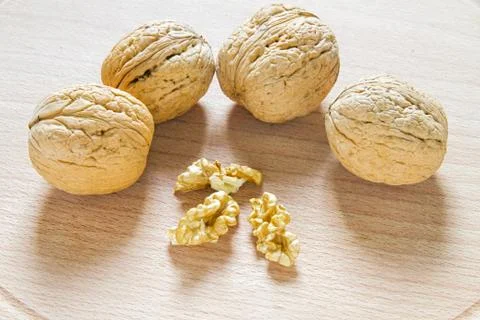 Walnuts on rustic  wooden table Stock Photos