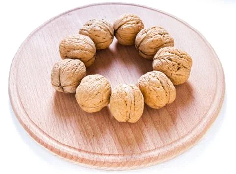 Walnuts on rustic  wooden table Stock Photos