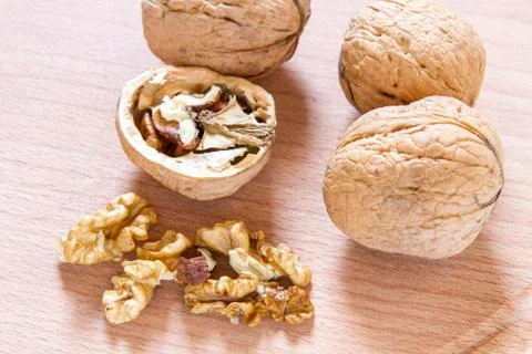 Walnuts on rustic  wooden table Stock Photos