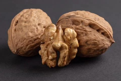 Walnuts scattered on a dark background, macro Stock-Fotos