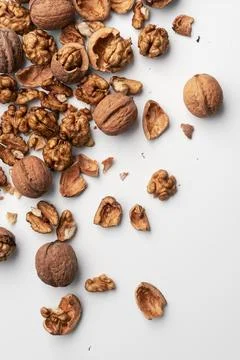 Walnuts with scattered shells. Still life concept of natural food, simplicity Stock Photos