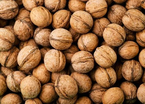 Walnuts in shell background. The view from top Stock Photos