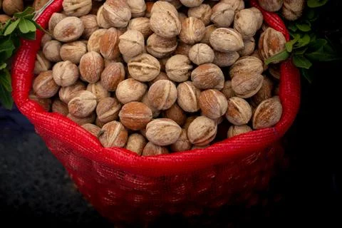 Walnuts in shell heap pattern as organic food background Stock Photos