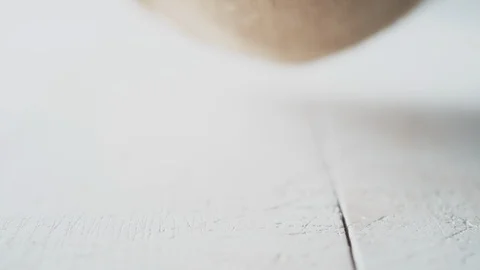 Walnuts in shell rolling out of burlap bag. Slow Motion. Stock Footage 89607306