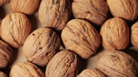 Walnuts in a shell rotating top view. Healthy snacks. Product rich in minerals Stock Footage 256858021