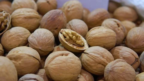 Walnuts in the shell sold at the market Stock Footage 197338503