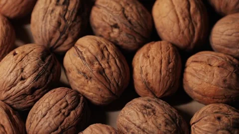 Walnuts in a shell top view. Healthy snacks. Product rich in minerals and Stock Footage 258372498