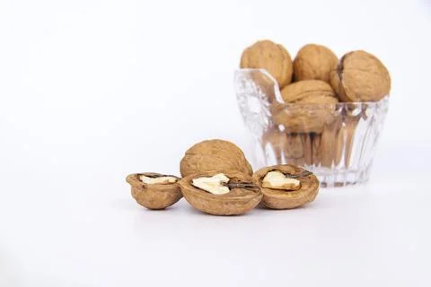 Walnuts in a shell on a white background. Healthy nuts. Stock Photos