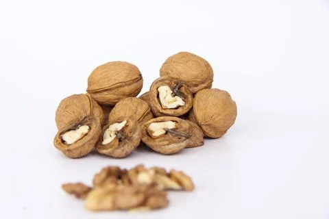 Walnuts in a shell on a white background. Healthy nuts. Stock Photos