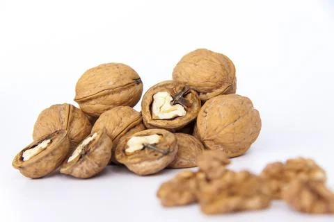 Walnuts in a shell on a white background. Healthy nuts. Stock Photos