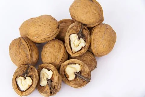 Walnuts in a shell on a white background. Healthy nuts. Stock Photos
