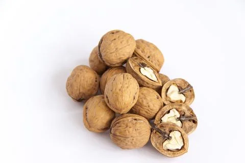 Walnuts in a shell on a white background. Healthy nuts. Stock Photos