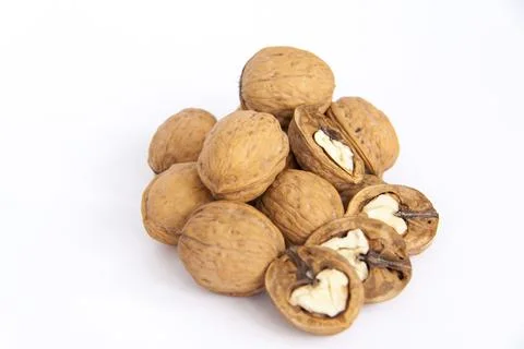 Walnuts in a shell on a white background. Healthy nuts. Stock Photos