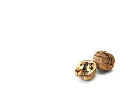 Walnuts with shell on white background Stock Photos