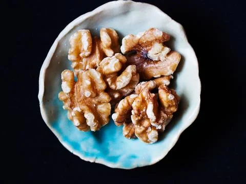 Walnuts in a small bowl Stock Photos