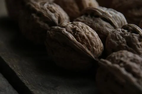 Walnuts on a vintage kitchen table. Stock Photos