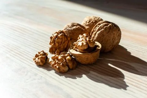 Walnuts on which the light of the beautiful sun falls Stock Photos