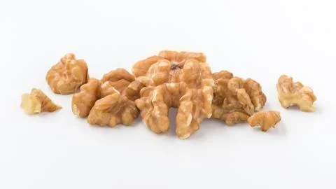 Walnuts on white background, closedup Stock Photos