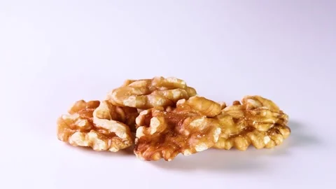 Walnuts on white background, rotating Stock Footage 313413420
