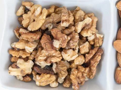 Walnuts in a white dish Stock Photos