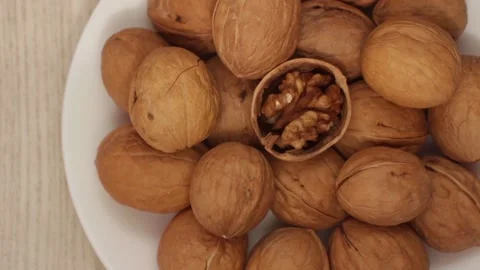 Walnuts on a white plate Stock Footage 124300466