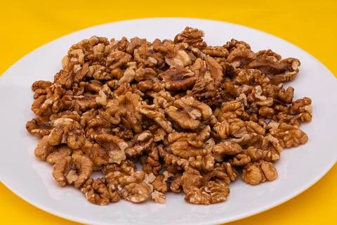Walnuts in a white plate Stock Photos