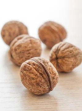 Walnuts on white table Stock Photos