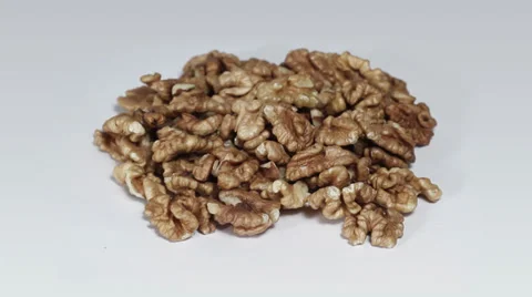 Walnuts on white turning close up Stock Footage 33731933