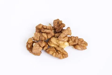 Walnuts without shells on a white background. Healthy nuts. Stock Photos