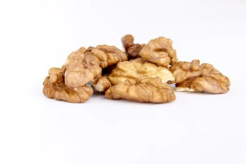 Walnuts without shells on a white background. Healthy nuts. Stock Photos