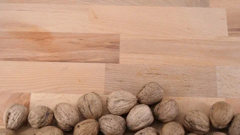 Walnuts on wood background, top view Stock Footage 85950576