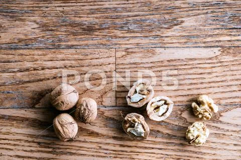 Walnuts on wooden background. Studio shot, copy space Stock Photos