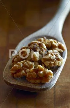 Walnuts On A Wooden Spoon