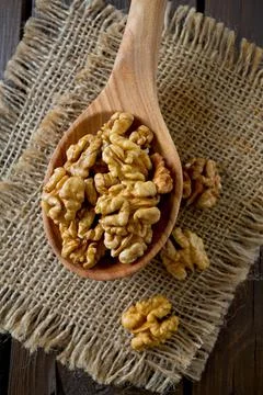 Walnuts on wooden surface Stock Photos