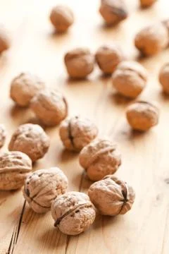 Walnuts on wooden table Stock Photos