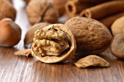 Walnuts on a wooden table Stock Photos