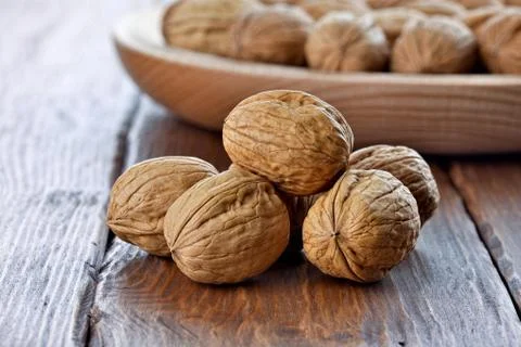 Walnuts on a wooden table Stock Photos