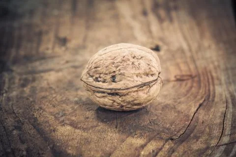 Walnuts on a wooden table. Stock Photos