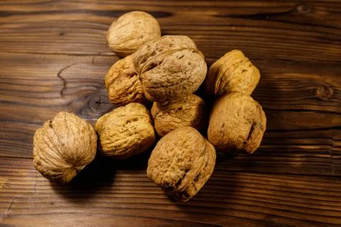 Walnuts on wooden table Stock Photos