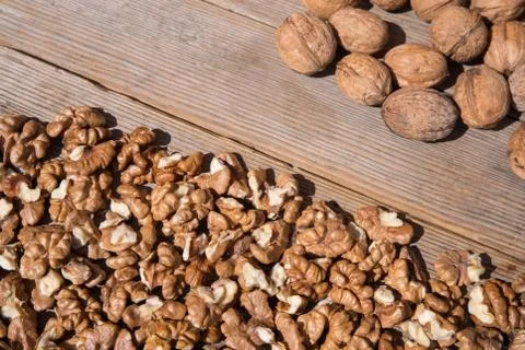 Walnuts on the wooden table Stock Photos