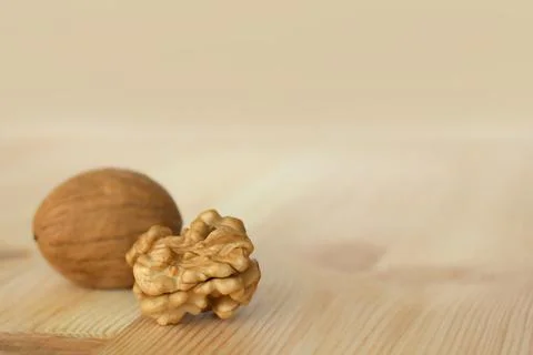 Walnuts on a wooden table Stock Photos