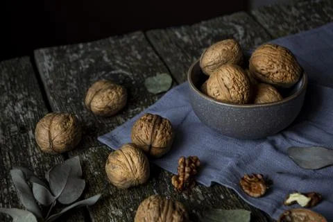 Walnuts on a wooden table Stock Photos