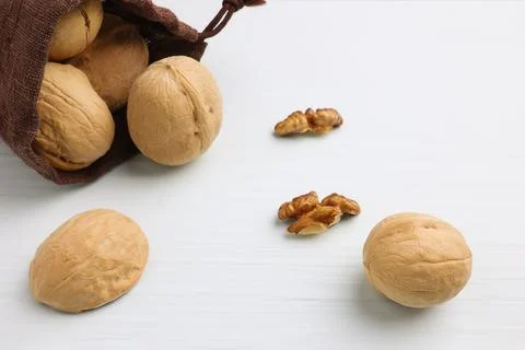 Walnuts on a wooden table. Soft focus. Stock Photos