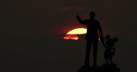 Walt Disney and Mickey Mouse Statue Big Sun Sunrise Timelapse Stock Footage 142304783