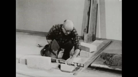 Walter Durbahn demonstrating the techniques of shelter building Stock Footage 44572249