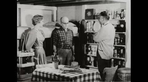Walter Durbahn giving neighbours a tour of his newly constructed home shelter Stock Footage