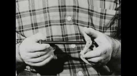 Walter Durbahn holding a nail Stock Footage 44572578