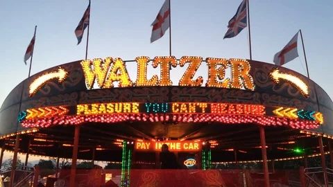 Waltzer ride at the evening Funfair Stock Footage 93866983